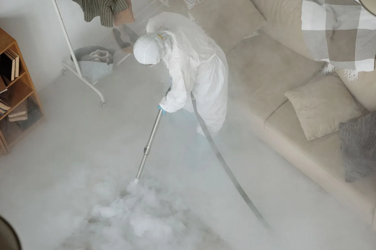 Biohazard cleanup technician in protective equipment, Johns Creek, GA